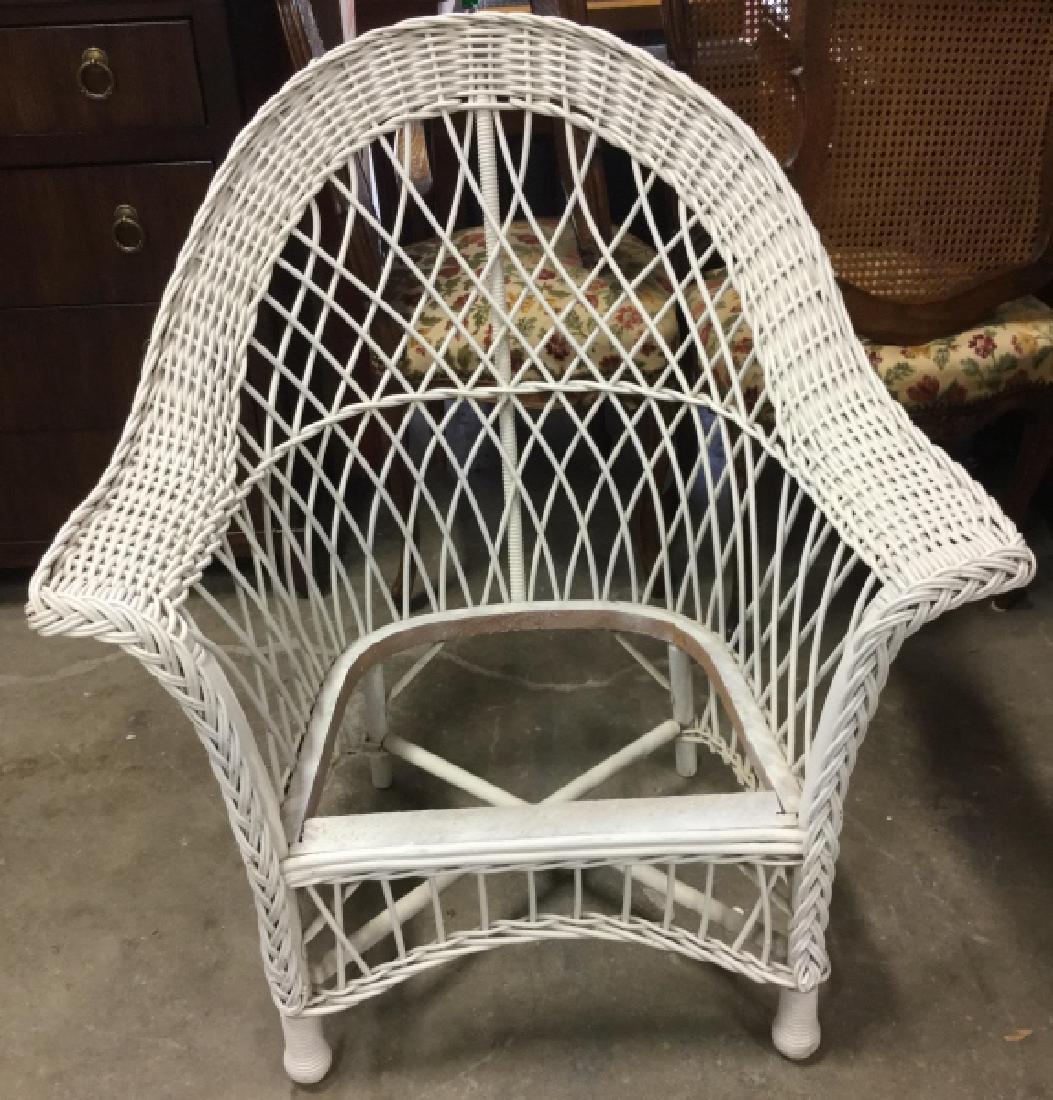 White Toned Outdoor Wicker Armchair: White Toned Outdoor Wicker Armchair. Contains evident wear and cracks in wicker. Measures approx 36 inches tall 33 inches wide, 27 inches deep. Does not include seat. whicker furniture, patio deck, ga