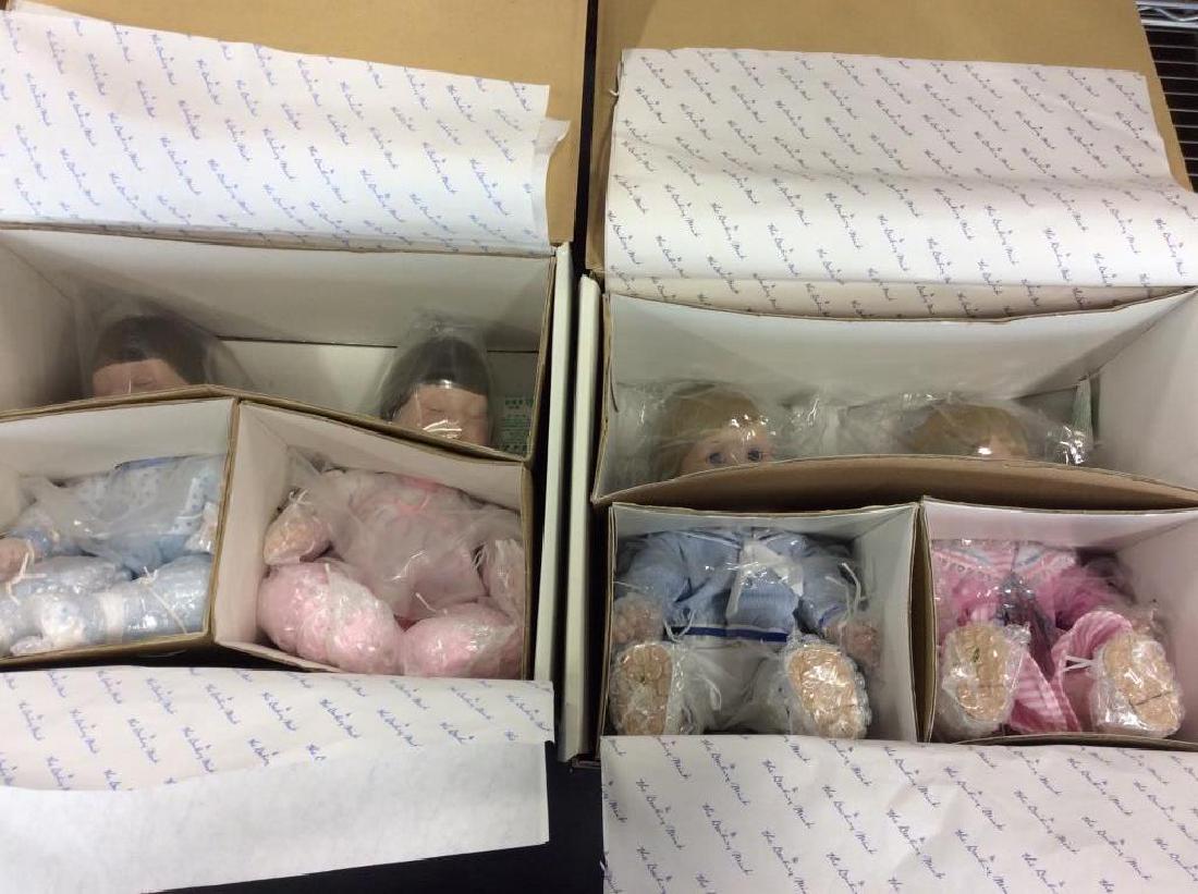 Group of 4 JENNIFER SCHMIDT Collectible Dolls: Group of 4 JENNIFER SCHMIDT collectible dolls. 2 boxes each with a pair of dolls. One box has Jamie & Jeffrey, the other has Meg & Michael. Boxes have been opened but dolls don’t appear to have been