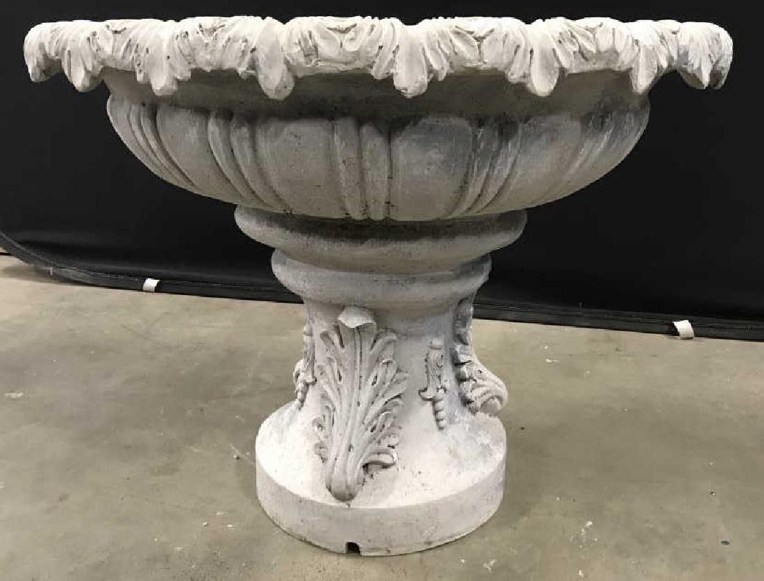 Outdoor Composite Water Fountain Bird Bath: Outdoor water fountain or bird bath in composite material. Fountain has leaf detail pattern and has a rounded embellished base. Blemishes and minor chips consistent with use and exposure. Fountain has