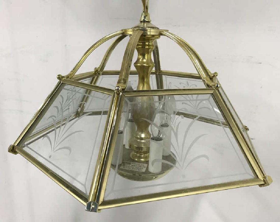 Gold Tone Metal Frame Hanging Pendant Light: Metal pendant light / suspender light / chandelier / hanging light / Candelabra. Metallic frame is gold toned with transparent plastic shades that look like glass. Shades have frosted floral motifs. P
