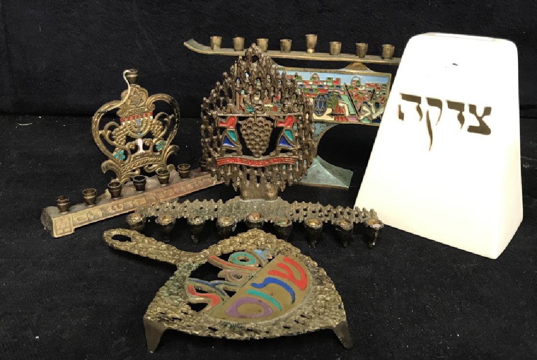 Group Lot of Ceremonial Judaica Menorahs More: Group Lot of Ceremonial Judaica, including 3 Menorah, and a trivet and a ceramic bank with Hebrew Lettering and The inscription You Shall Open your Hand wide to your brother, to your poor, and to your