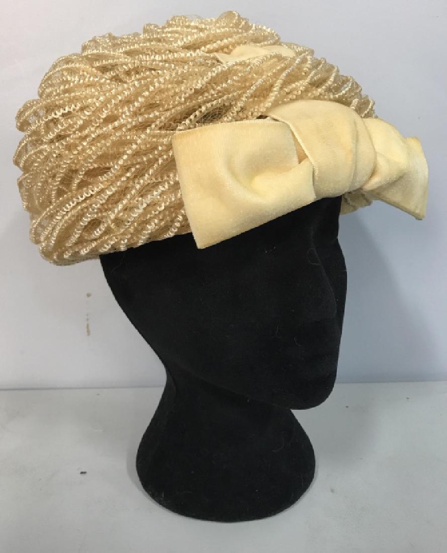 MR JOHN JR Tan Toned Women’s Hat: Tag on inside of hat reads MR JOHN JR. HAT is tan toned with tied bow on front. Measures approx 9 inches wide 5.5 inches tall. Women’s hat, ladies hat, tan hat. Includes box, box has some wear and t