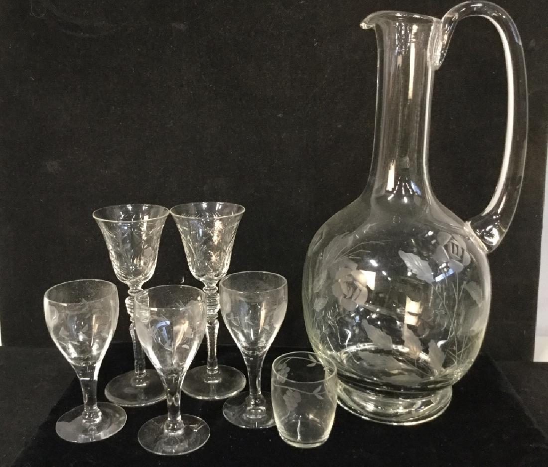 Group Lot of Crystal Sherry Set: Group Lot of Crystal Sherry Set including 6 stemmed Sherry glasses, 1 sherry Pitcher and a sherry beaker, all good condition, Largest wine measures 6 in x 2 1/2 in at lip, Sherry Decanter/ Pitcher Mea