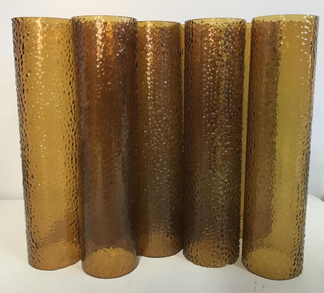 Set of 9 Cylinder Taper Chimney Candle Covers: Set of 9 cylinder taper chimney glass candle covers. Color of glass is honey yellow. Glass is textured. Each approx 14 inches tall by 3 inches in diameter. Interior / exterior lighting decor / accesso