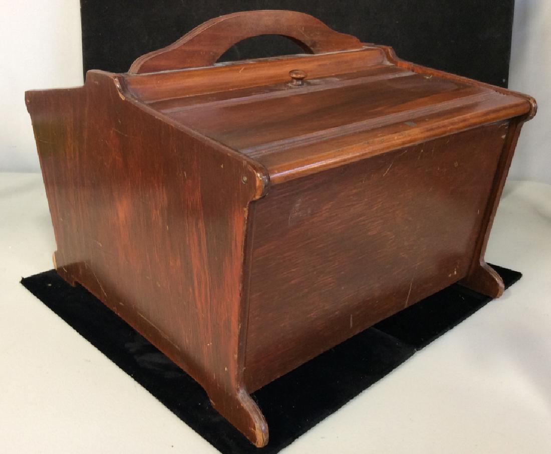 Vintage Mahogany Sewing Box: Vintage Mahogany Sewing Box, 12 in x 10 in x 12 in deep, scuffing and small piece of wood from rear foot missing, otherwise good condition, with carrying handle amd two compartments with lids, interio