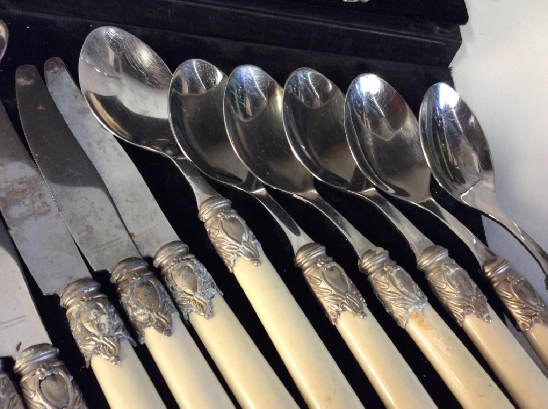 Vintage Faux Bone tableware: Vintage Faux Bone Renaissance Stainless Steel Tableware, including 6 salad forks, 5 dinner forks, 6 tablespoons, 4 teaspoons, 6 knives, largest measures 9 3/4 in long, several have pieces loose from b