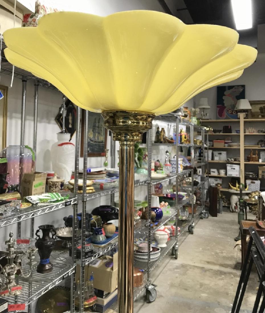 Gold Toned Metal Floor Lamp: Body of lamp is gold toned. Top piece appears to be plastic. Base is round. Contain some wear. Measures approx 67 inches tall 17 inches tall at top. Floor lamp, vintage lighting, home accessory, art d