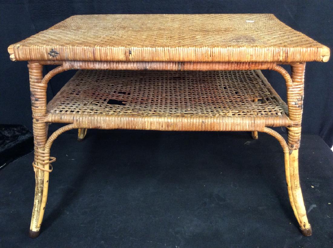 Caned Coffee Table: Coffee table possibly has bamboo legs. Has holes in lower level of caning. Measures approx 18 inches tall, 27 inches long, 19 inches deep. Home furniture, end table, side table, plant stand.