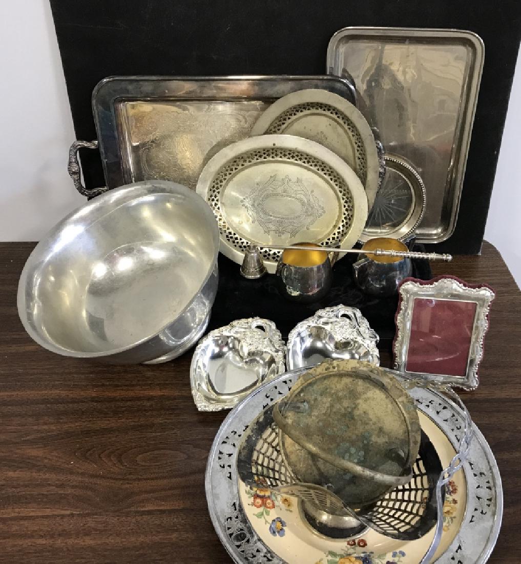 Misc Silvervplate, Pewter, and Electroplated items: Misc Silverplate Pewter, And Electroplated Servers, plates, platters, including, a candy Basket, Wine bottle coaster several sweet mean dishes, A Pewter fruit bowl,a silver plate picture frame, a cand
