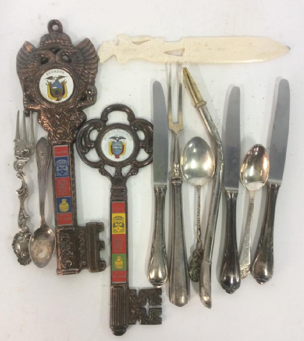 Silver Toned Tableware And more: Mixed metal and enamel souvenir keys tallest measures app 9 inches, silver spoons fork and knives marked 100, and carved bone letter opener, group Lot desk accessories, collectibles