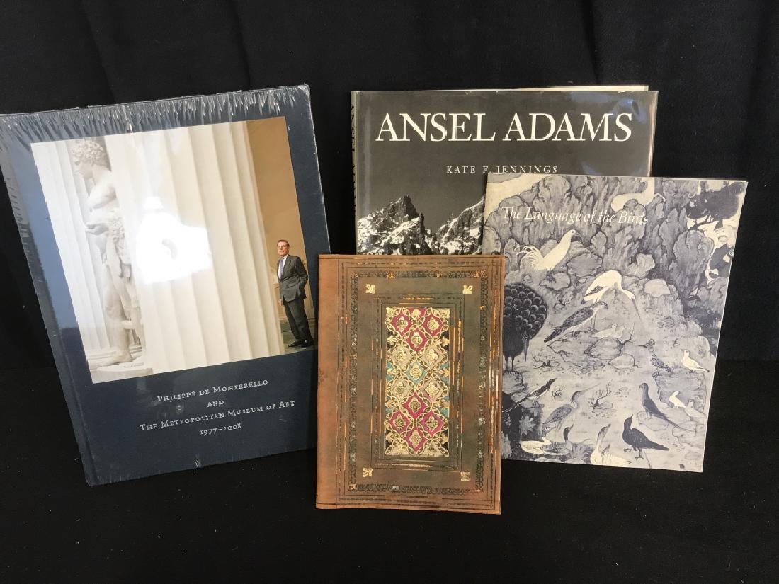 Lot 4 The Met Andsel Adams Art Books & More: Lot 4 Philippe De Montebello and The Metropolitan Museum of Art, Amstel Adams, The Language of Birds Art Books, and Leather book cover with gold leaf floral and vine design. The Met Book is wrapped in