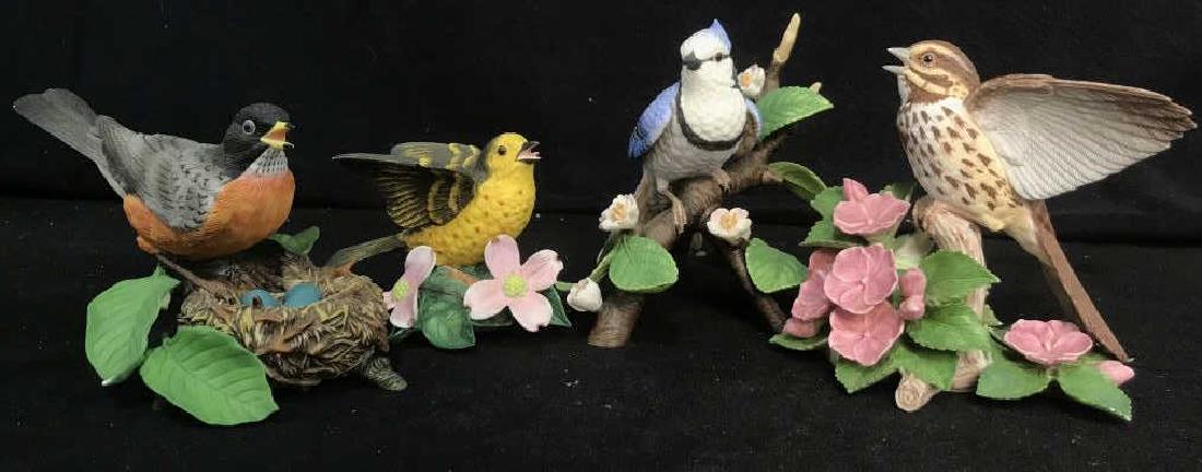 Set of 4 LENOX Porcelain Bird Figurines: Set of 4 LENOX collectible fine porcelain spring bird figurines. This set includes: a vintage 1989 American Robin; a vintage 1994 Yellow Warbler; a 1995 Female Bluejay; and a 1998 Song Sparrow. Some m