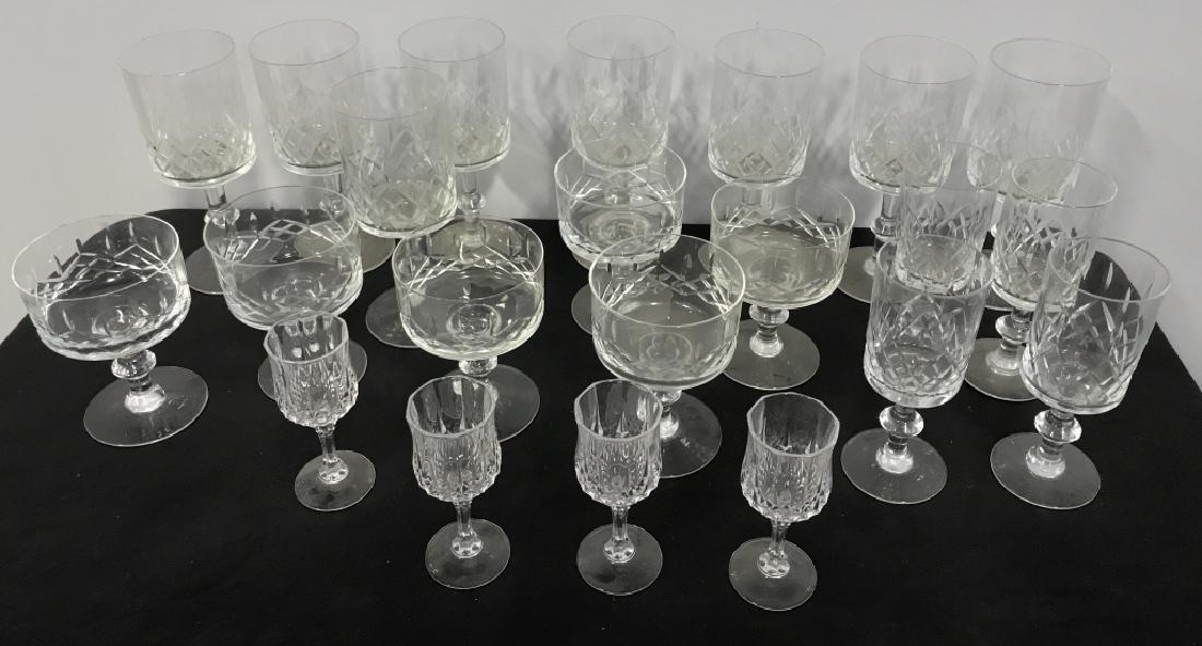 Lot 21 Cut Crystal Glass Barware: Lot 21 Cut Crystal Glass Barware, wine, champagne and port glasses. No condition issues noted. Largest measures approx 7.5 inches tall. Wine Glasses, holiday entertaining, bar wear. 2