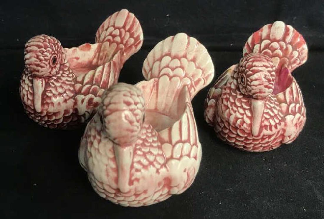 Set of 3 Tea Lights Stylized as Birds: Set of 3 tea lights / candle holders stylized as birds / pigeons. Birds are ceramic and magenta and white in tone. Birds have been used before and have some wax residue. Each bird is approx 3 inches i