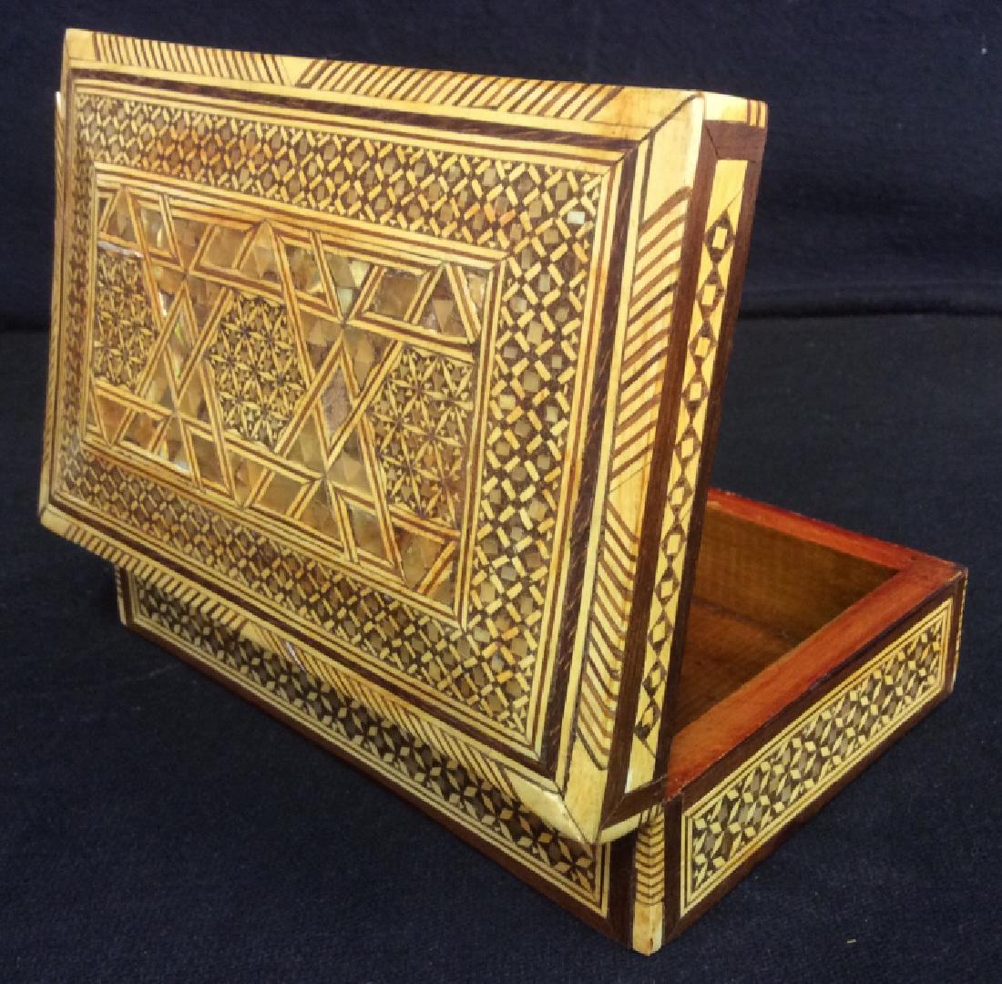 Wood Middle Eastern Mother Of Pearl Mosaic Box: Middle Eastern mosaic trinket box with wood and mother of pearl pieces. Possibly Syrian or Egyptian. Mosaic pattern has mother of pearl inlay. A couple mother of pearl mosaic pieces are missing. Some 