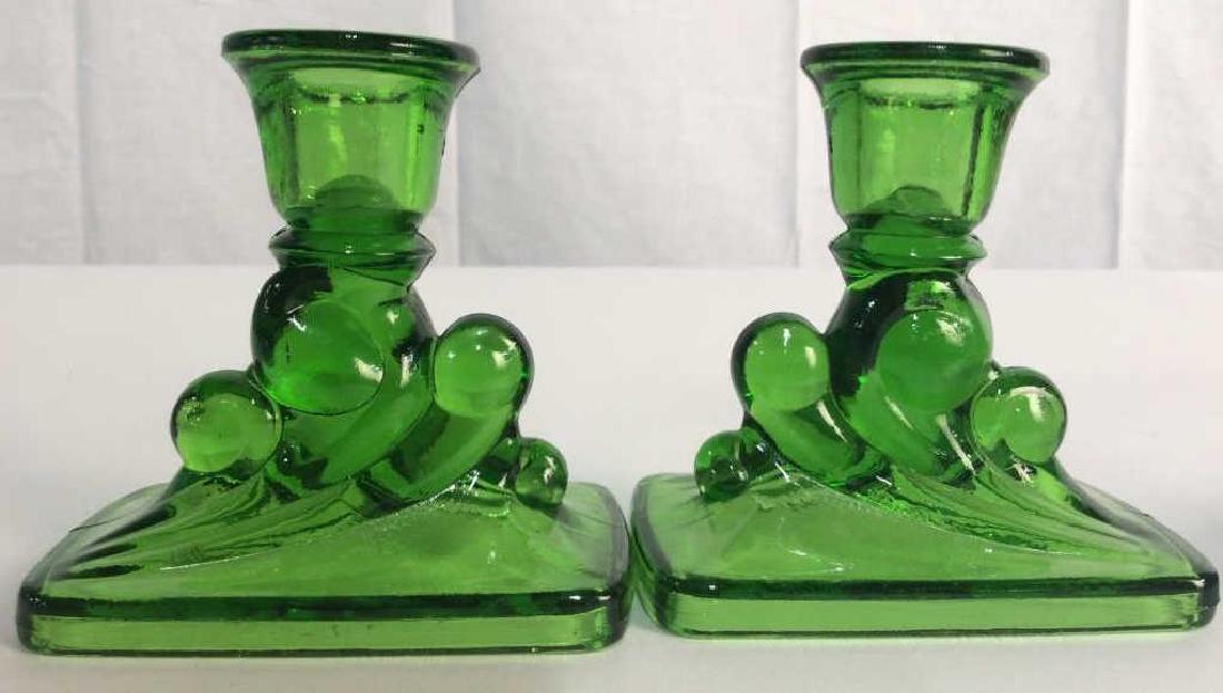 Pair Vintage Green Glass Candlesticks: Vintage scrolled green glass, collectible tableware, table accessories, collectible glassware, each measures app 4.5 inche ht width app 4 inches,