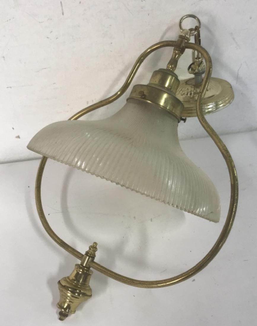 Gold Brass Tone Pendant Light Fixture: Light gold brass tone pendant light fixture. Metal frame with textured glass shade. Fixture is aged, and has moderate discoloration. Glass shade needs cleaning. Has not been tested. Approx 23 inches i