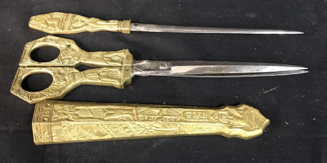 HAMMESFAHR SOLINGEN Gilt Bronze Desk Set: Three piece bronze desk set gilded and gold toned includes sheets, scissors, length 10 inches and letter opener measures 9.5 inches, Egyptian Motif, design in raised relief, marked for Germany,and bra