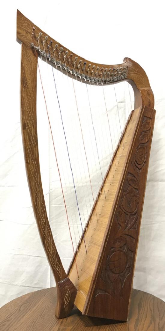 Carved Wooden Harp With Celtic Design: Carved Wooden Harp With Celtic Design, includes tuning key, marked with sticker that reads Made In Pakistan. Not been tested, no condition issues visible. Measures approx 36 inches tall x 18.5 inches 