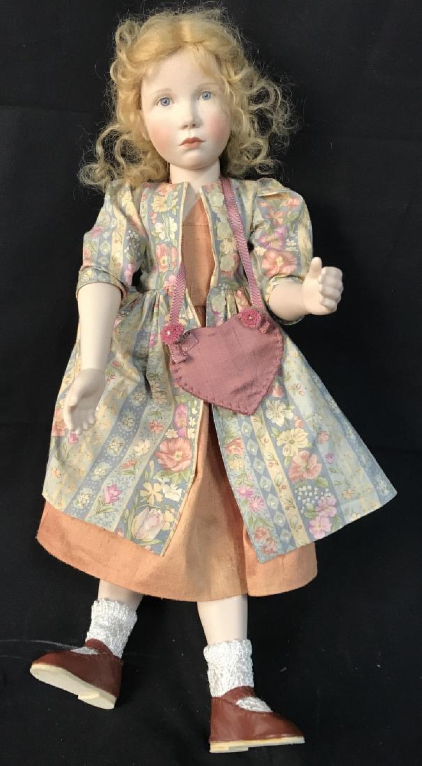 Regina Sandreuter labeled Doll With Clothing: Articulated joints, painted face, possibly human hair, measures app ht 17 inches, collectible doll, label reads Christine 2001
