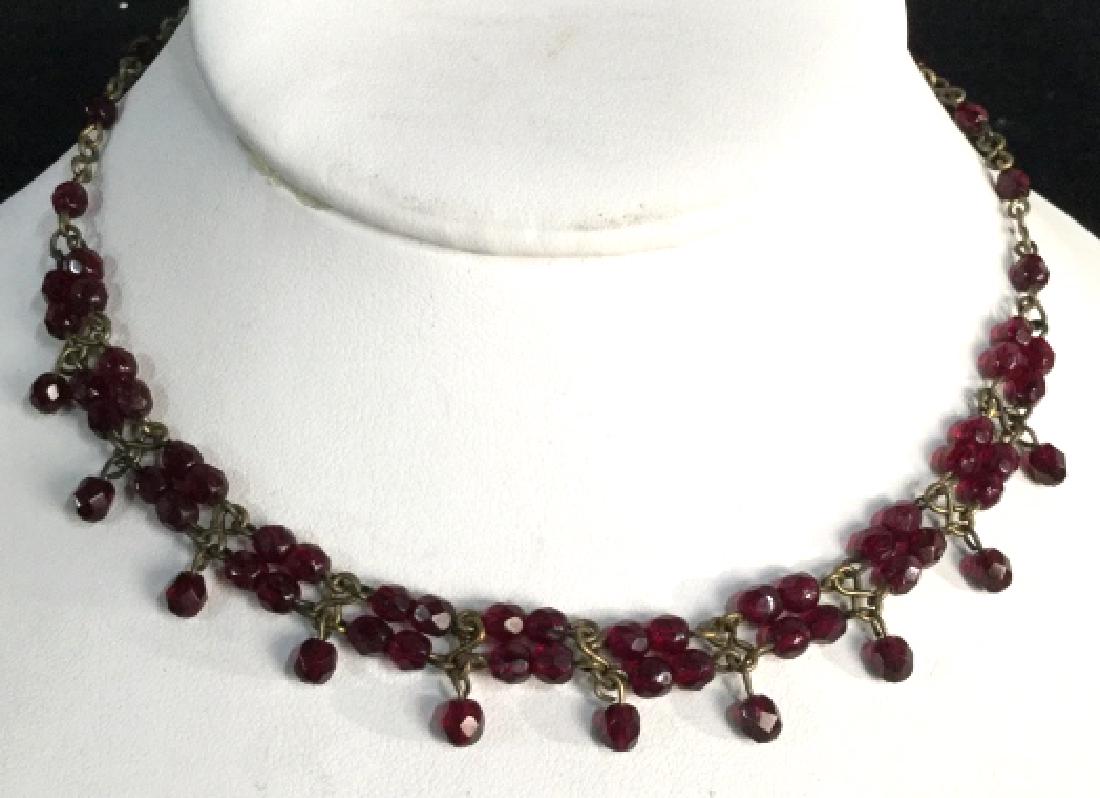 ROBERT ROSE Brass & Red Tone Choker Necklace: Robert Rose Brass and ruby red tone choker necklace. Necklace has ruby red transparent beads. Vintage Jewelry, statement necklace, costume jewelry. Drop length of necklace strand measures approx 6.5 i