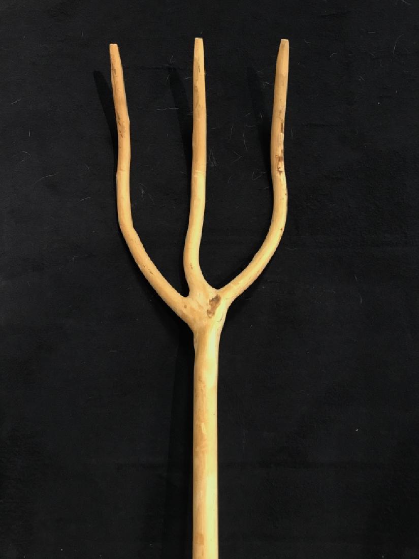 Carved Rustic Wooden Three Pronged Pitchfork: Carved Rustic Wooden Pitchfork. Country House Decor. Farm House. Farm Tools. Hand Made Wooden Tools. A hand carved three pronged pitchfork made out of a single piece of wood. Minor surface scratches a