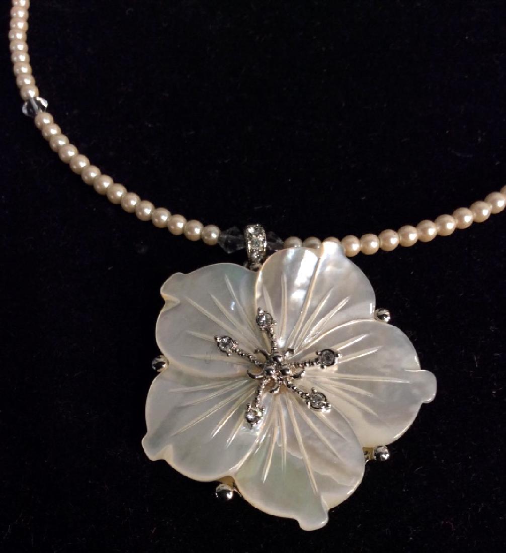 Beaded Choker Necklace W Pearlescent Pendant: Beaded choker necklace with pearlescent flower pendant. Necklace has some rhinestone embellishments. Vintage Jewelry, statement necklace, costume jewelry. Marked Monet on underside of pendant. Necklac