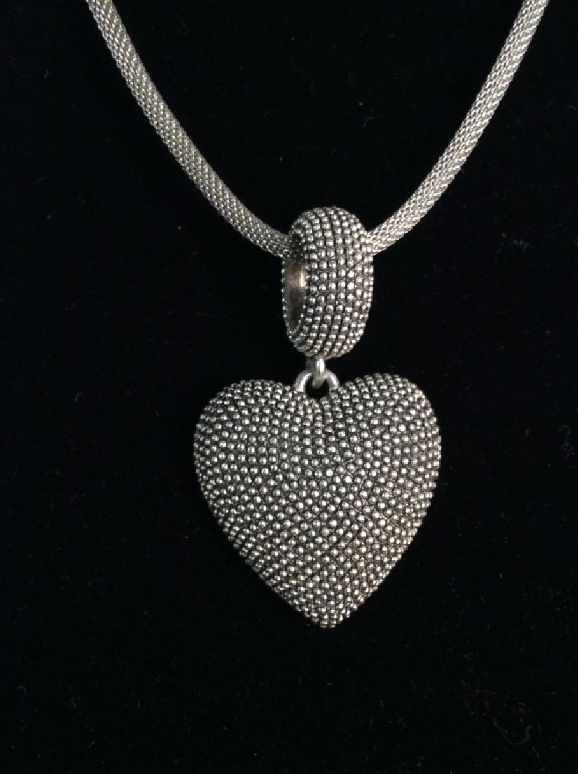 ERWIN PEARL Necklace W Heart Pendant: ERWIN PEARL silver tone necklace with textured heart shaped pendant. Vintage Jewelry, statement necklace, costume jewelry. Underside of pendant marked E Pearl. Drop length of necklace strand measures