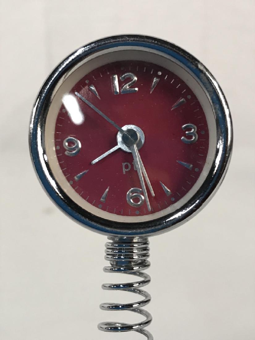 Silver & Pink Toned Spring Desk Clock: Clock is silver toned With pink toned clockface. Measures approx 4.5 inches tall 1.5 inches wide. Has not been tested. tableware, tabletop accessory, office accessory. 6