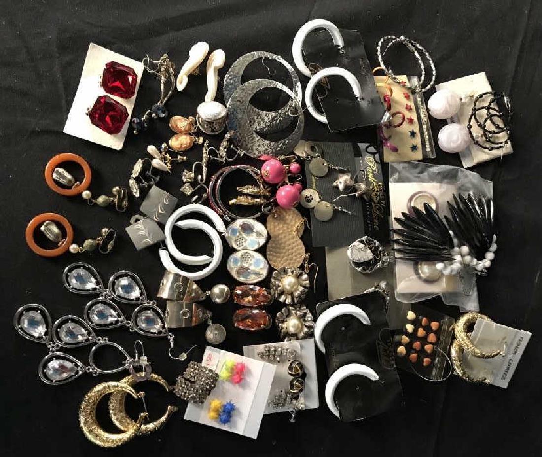 Group Lot Vintage Mod Jewelry Earrings: Group Lot of Flip on earrings, pierced earrings, fashion jewelry, some with original packaging,earrings includes rhinestones, hoops, white plastic, Bakelite, pink balls, silver toned, gold toned, dang