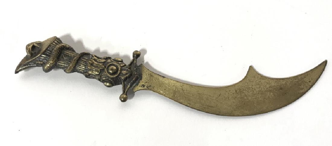Gold Toned Metal Dagger Letter Opener: Gold Toned Metal Dagger Letter Opener. Handle has serpent detail. Contains evident wear. Appears to be vintage. Desk Accessory, Table top decor, Measures approx 7 inches long. 6
