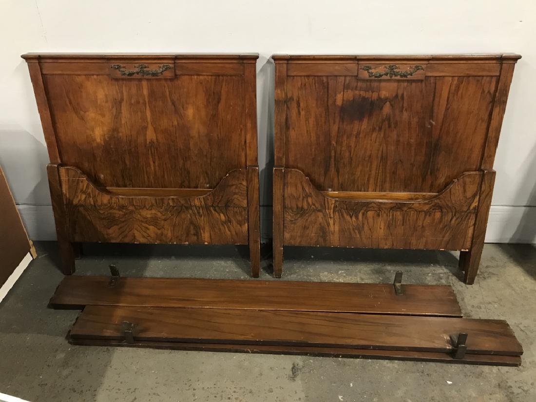 Pr Antique Federal Style Wooden Twin Bed Frames: Pr Antique Federal Style Twin Bed Frames, possibly mahogany with floral and leaf metal garlands mounted on headboard. Beds are in a very richly toned wood, possibly veneer, and show intricate grain pa
