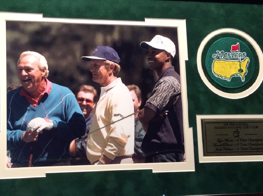 Framed Photo Print Of Professional Golfers & Patch: Photo print depicts Jack Nicklaus Arnold Palmer & Tiger Woods. Also includes a Golf Masters patch and a Plaque with the 1996 Masters Augusta National Golf Club stats. Piece is professionally framed wi