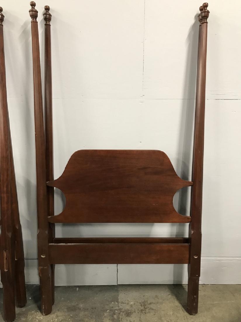 Twin Craftique Four Pencil Post Wooden Bed: Twin Craftique Four Pencil Post Bed in posssibly cherry or mahogany toned wood. Both headboards have sticker that reads Authentic Reproduction by Craftique, inc, Mebane, NC. Property of a Greenwhich,