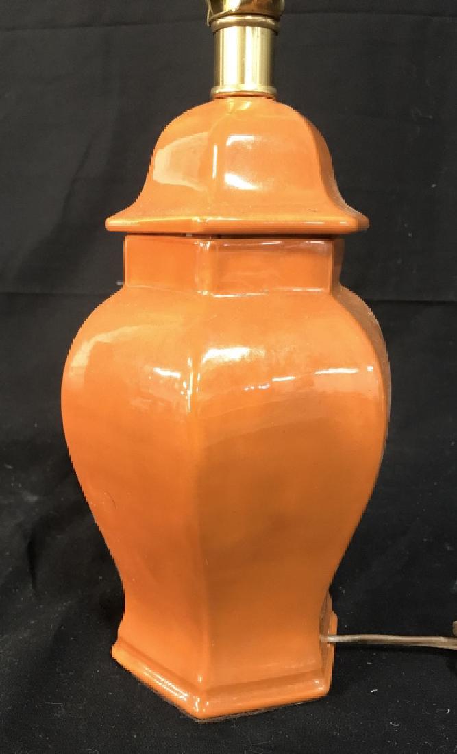 Tangerine Ceramic Porceline Lamp: Orange tangerine toned porcelain ceramic lamp, white flower design on one side, ginger jar shape, ht to harp finial measures 20 inches