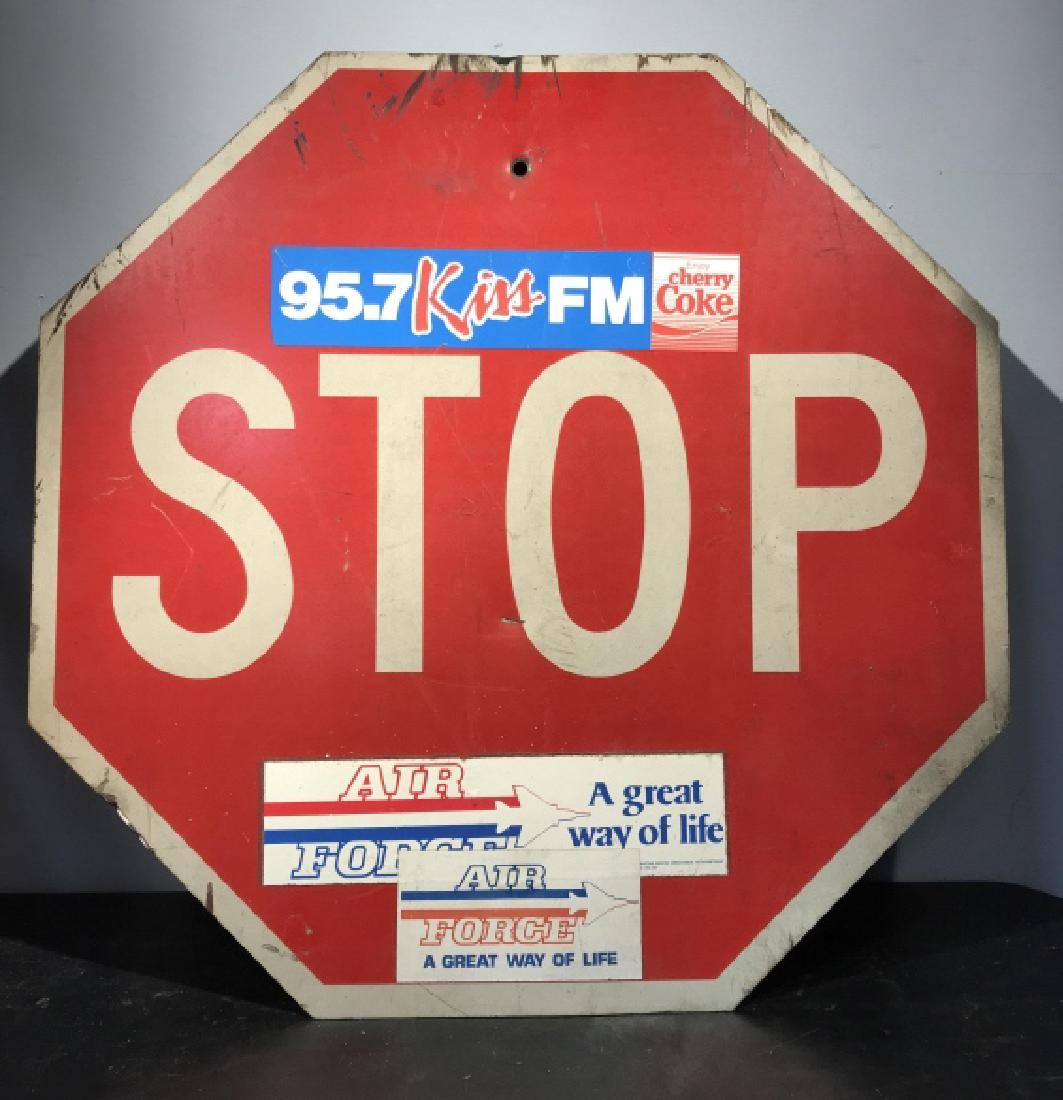 Vintage authentic‘Stop’ Traffic Sign with Stickers: Authentic ‘stop’ traffic sign with some stickers on it. Stickers are for 95.7 Kiss Fm and Air Force. Stop sign has been used and has some rust, dents, and scratches consistent with exposure. Metal