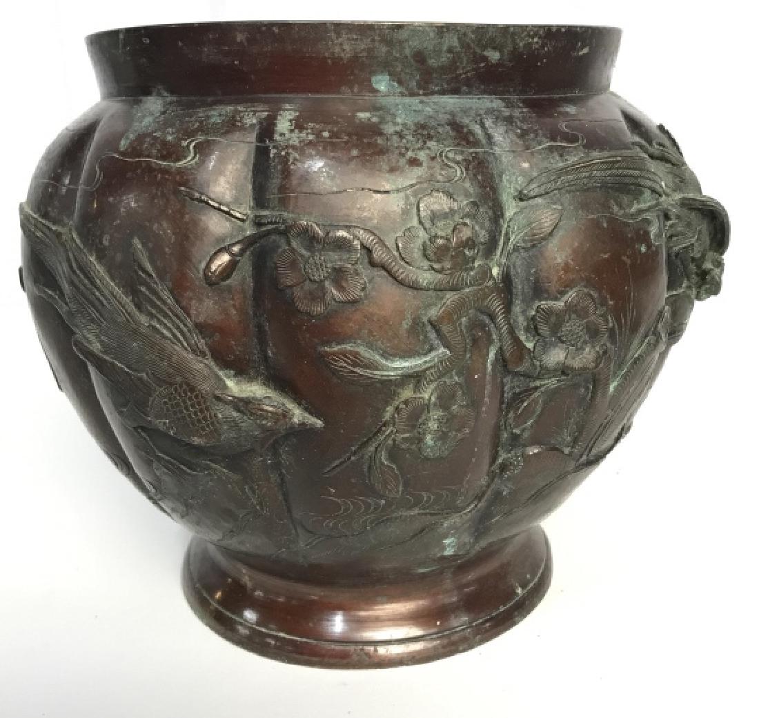 Japanese Bronze Vessel Bird Cherry Blossom Design: Japanese Bronze Vessel with Bird and Cherry Blossom Raised Design. Bronze Planter. Japanese Bronze Tabletop Accessories. Bronze Home Decor. Piece needs cleaning and has some patina to metal. Measures 