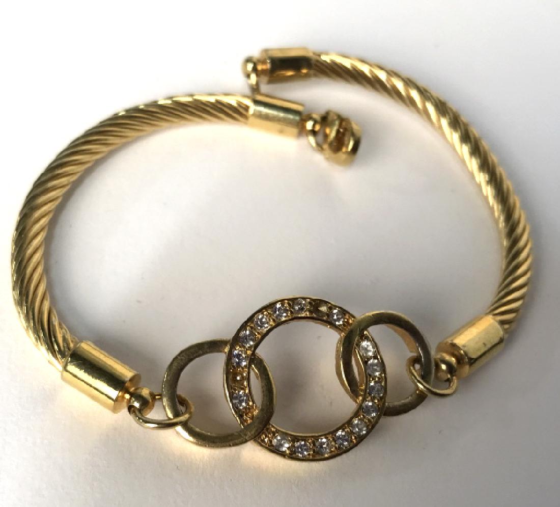 Group Lot of Fashion Bracelets: Group Lot of 3 costume gold toned chain link bracelets, 1 rose gold toned with toggle clasp, 1 green gold toned with park lane stamped medallion, 1 double sided bangle with open disk pave set rhinesto