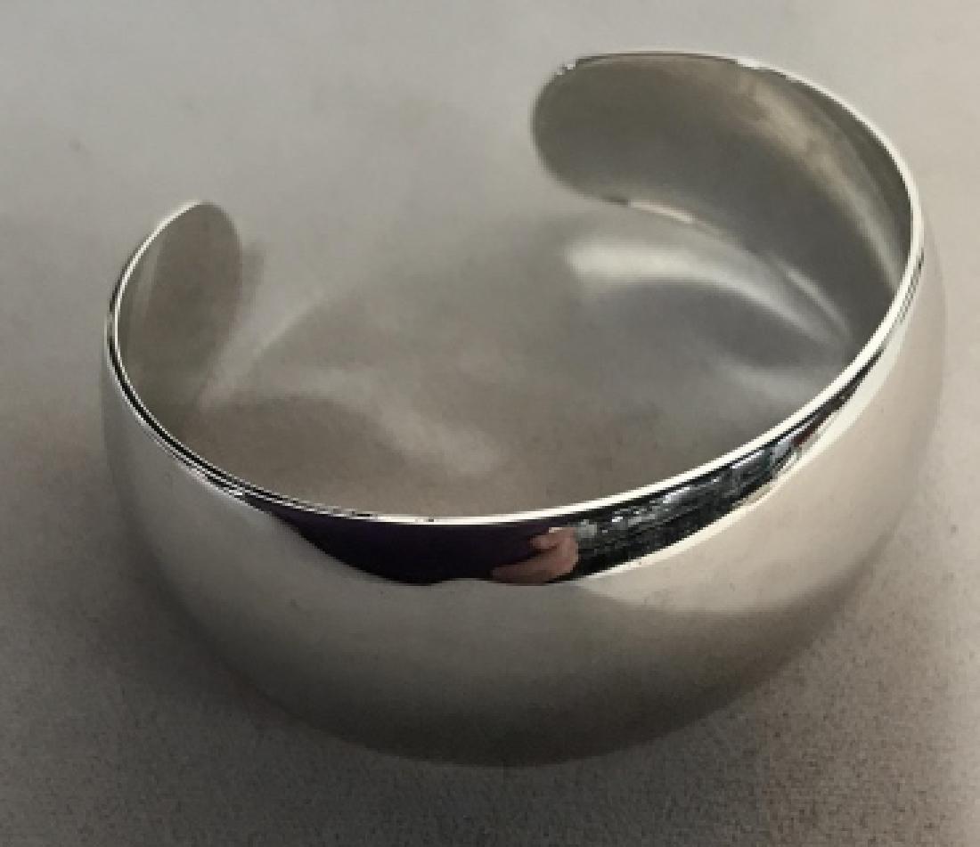 Monet Polished White Gold Toned Cuff Bracelet: Monet Polished White Gold Toned Bangle, signed on inside of cuff, good condition, 2 1/2 in diameter, width 2 3/4 in, Signed Designer Costume, Vintage Collectibles, Estate Jewelry, Monet Jewelry, 5