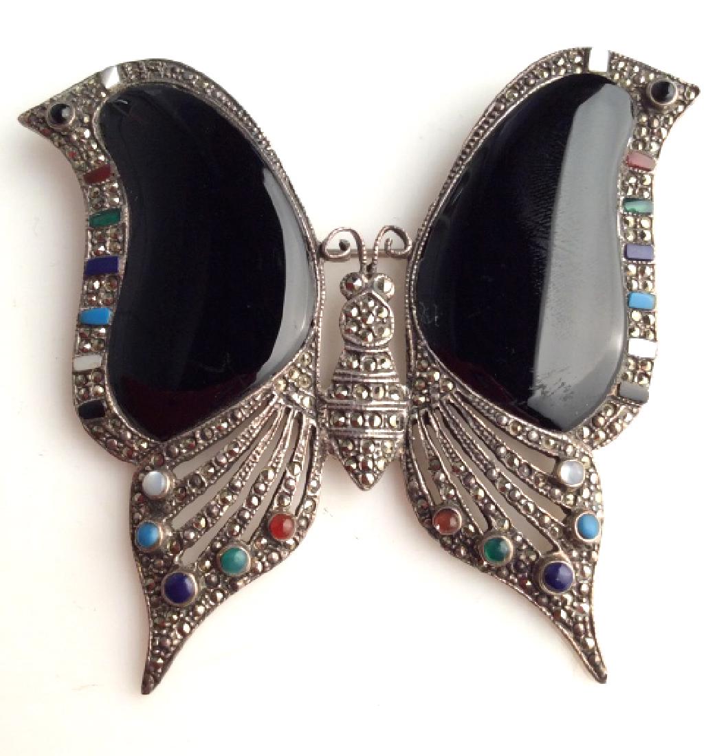Sterling Silver Marcasite & Onyx Butterfly Pin: Sterling Silver Marcasite & Onyx Butterfly Pin. Marked for 925 on reverse, sterling silver metal body set with large black toned smooth polished stone, possibly onyx, set with marcasite, and other nat