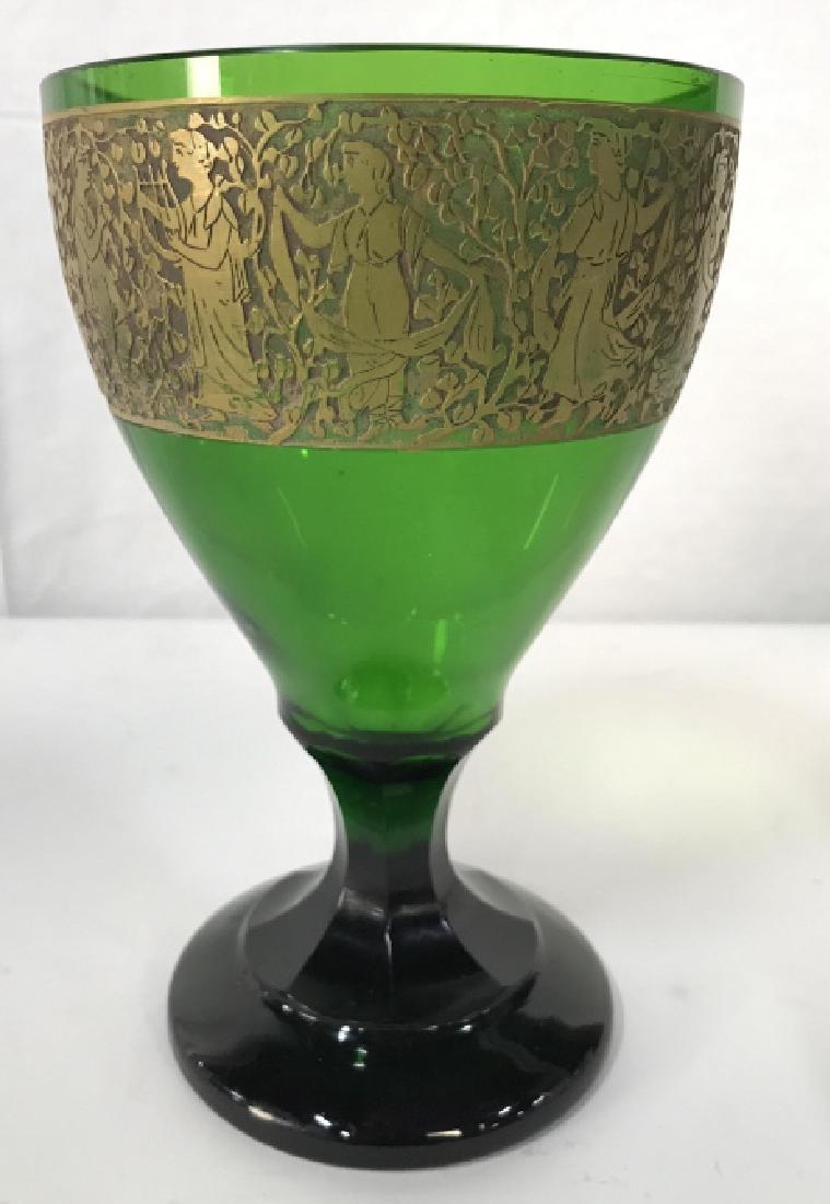 HAIDA Cut Crystal Chalice: Chalice is green toned with intricate gold toned detail. Rim detail depcits greco roman classical scene with women standing together. Underside is marked HAIDA. Measures approx 8 inches tall 5 inches 