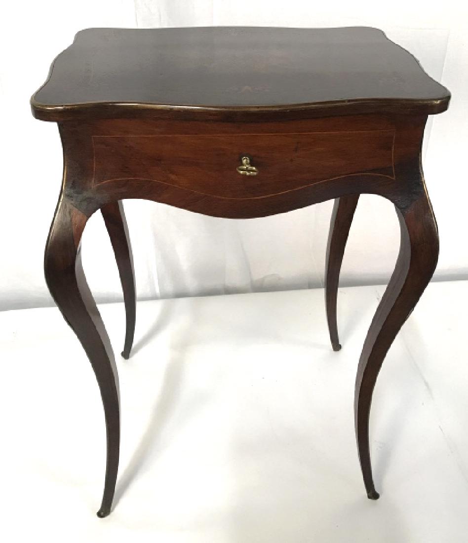 French 18th C Style Accent Table W Marquetry Top: French 18th C Style Accent Table, Poss Antique, Marquetry Flip Top With interior compartment and mirror with gilt metal frame, Cabriole legs, brass toned metal key and table edge. Marquetry top has in