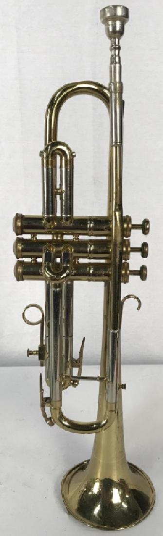 Lot 3 BESSON Gold Toned & Mouth Pieces: Trumpet is marked BESSON MADE IN ENGLAND. One Mouthpiece is marked BESSON 6 A the other is marked VINCENT BACH CORP. Both mouth pieces are silver toned. Instrument measures 21.5 inches long with mouth
