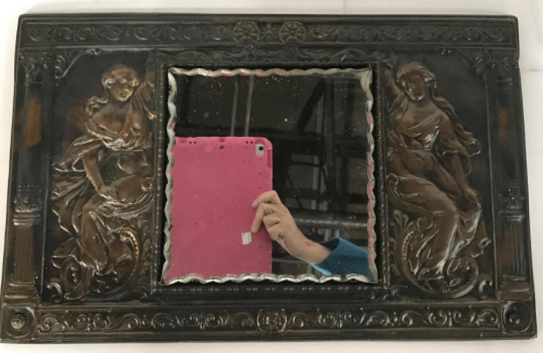 Copper Relief Partial Nudes Mirror: Grecian style columns and figurals flank a scalloped mirror, scene in copper relief, vintage possibly antique mirror measures app 12.5 by 20 inches, wall mirror, wall plaque, decorative accessory, hom
