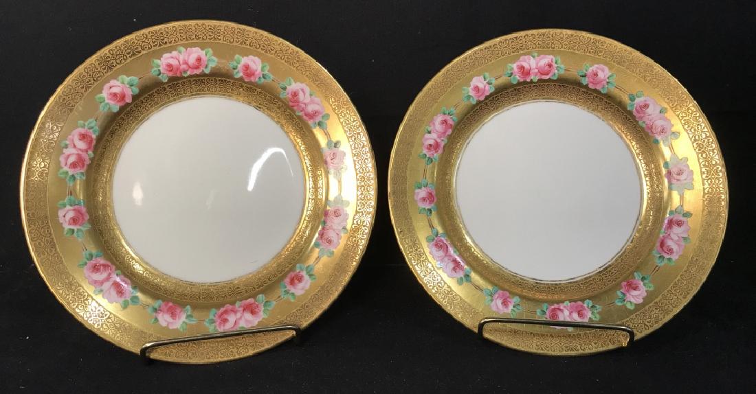 Pair Gilman Collamore Gilt Porcelain Dishes: Pair Gilman Collamore porcelain dishes with gilt border, and hand painted pink and green rose motif, marked on reverse with numbers, Gilman Collarmore Fifth Avenue & 30th st. Made In England. Minor su