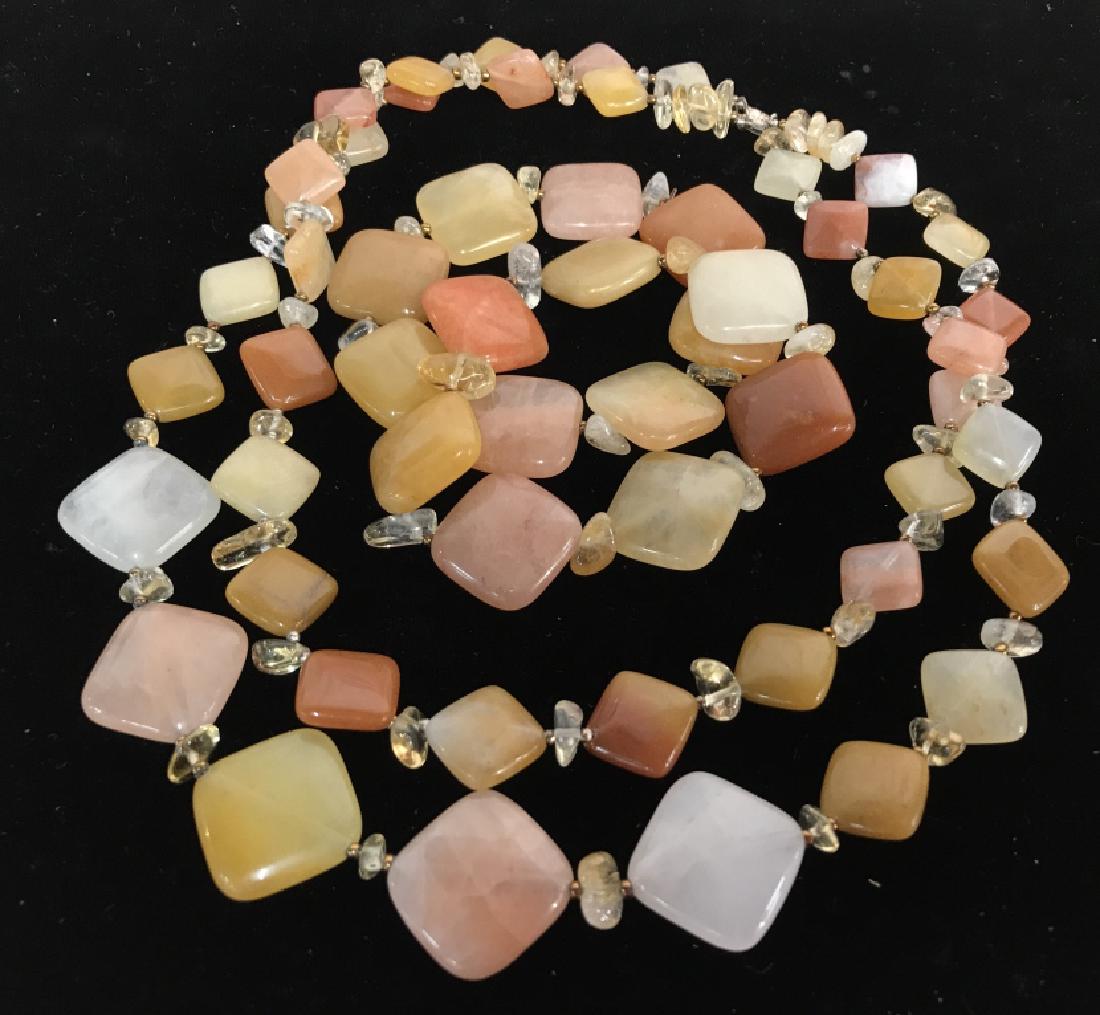 Polished Stone Necklace w 2 Bracelets: Polished natural stone in Diamond shapes form chain necklace in tones of punks creams, corals and Carmel’s, honey tones, necklace is double strand with drop of app 9 inches, each bracelet diameter a