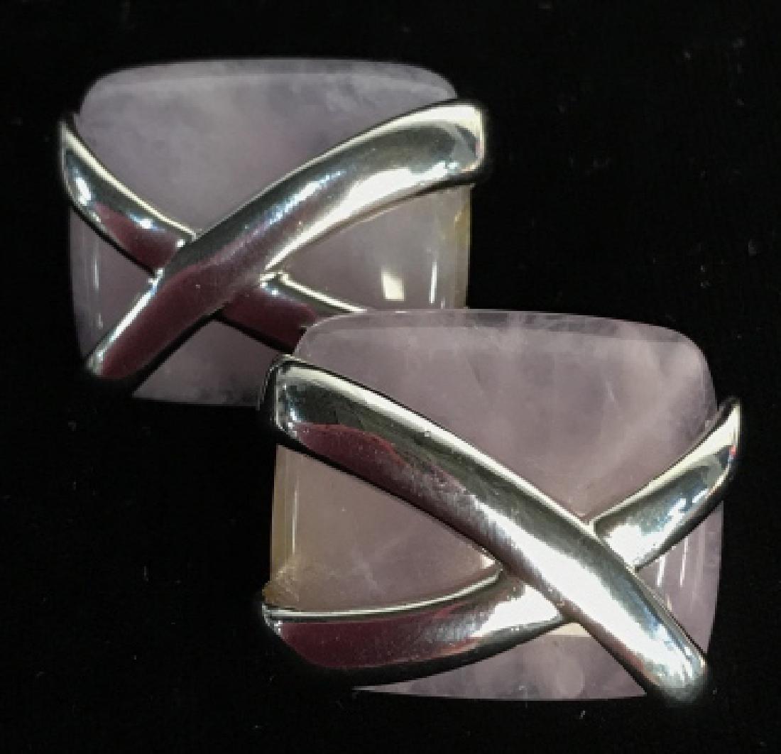 Violet Stone and Picasso X Earrings: Natural stone rectangular earrings striated purple and violet hues, possibly Amethysr, overlaid with iconic Paloma Picasso X form in Silver Toned Metal, each measures app 1 inch by .75 inches, clip ea