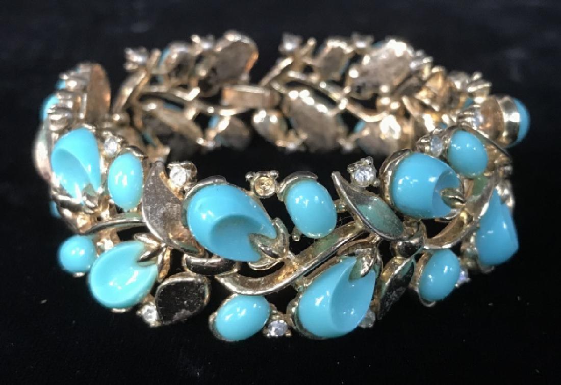 TRIFARI Turqoise Diamond And Gold Toned Bracelet: Costume jewelry, vintage jewelry, marked for TRIFARI, statement bracelet of entwining vine leaf and buds, reticulated, links moveable, measures length app 7 inches width app 1 inch, designer costume j
