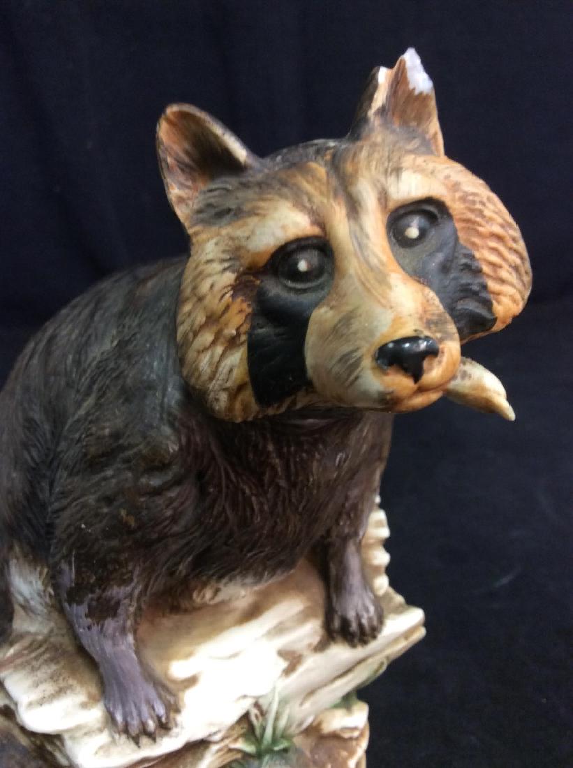 Vintage Porcelain Raccoon Bottle: Porcelain, ceramic pottery bottle in raccoon form, chip to ear, underside marked Ski Cou try, straight bourbon Whiskey, golden Colorado, raccoon limited edition 1974, Ross company, measures ht app 10 