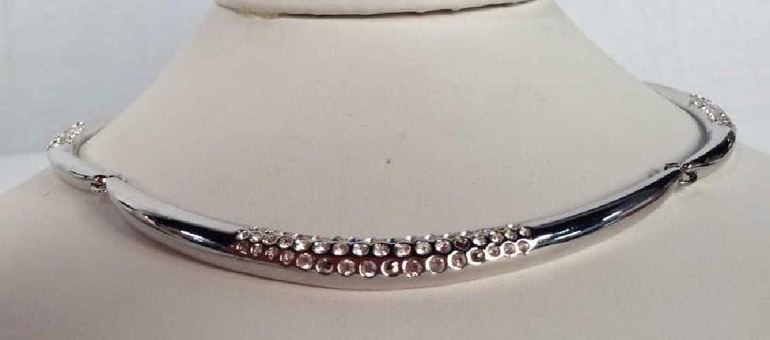 MONET Rhinestone Encrusted Necklace: Rhinestone Encrusted silver tone necklace. Appears 2 rhinestones are missing. Signed for MONET. Hook clasp closure. Drop length of necklace Approximately 7.5 inches. Vintage Jewelry, statement necklac